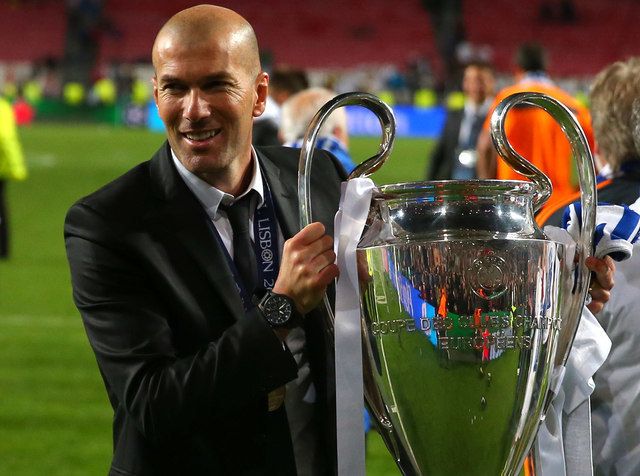 FILE - In this May 24, 2014 file photo, former player and current Real Madrid B team coach Zinedine Zidane lifts the Champion League trophy, at the end of the Champions League final soccer match between Atletico Madrid and Real Madrid in Lisbon, Portugal. Real Madrids President Florentino Perez announced Monday Jan. 4, 2016 that current coach Rafael Benitez has been fired and former player and Real Madrids B team coach Zinedine Zidane will take over. Benitez, hired seven months ago, has been under pressure since a demoralizing 4-0 home loss to Barcelona in November. (AP Photo/Andres Kudacki, File)