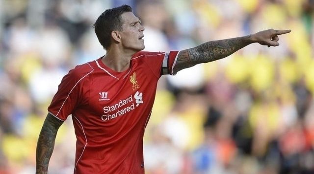 Simon Makienok of Brondby (L) and Daniel Agger of Liverpool walk on the pitch on July 16, 2014 at Broendby stadium during a test match between Brondby and Liverpool. Broendby won 2-1. AFP Photo / / Scanpix DENMARK / Liselotte Sabroe / DENMARK OUT (Photo credit should read LISELOTTE SABROE/AFP/Getty Images)